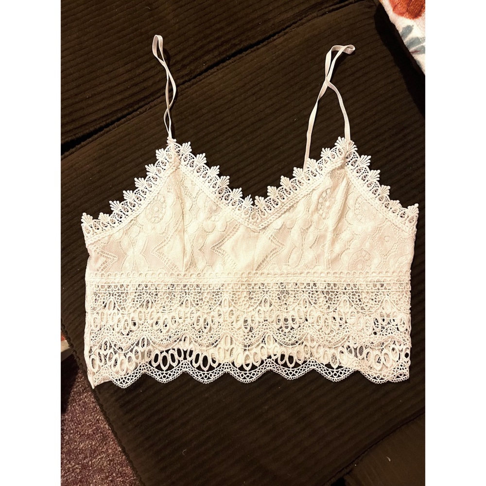 Brand new. Never worn. White lace crop top from SHEIN.